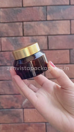 Load and play video in Gallery viewer, Amber Color Glass Jar With Satin Gold Lid For Lip Balm, Body Butter, Cream- 25gm, 30Gm,50 Gm [ZMJ12]
