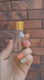 Load and play video in Gallery viewer, Transparent Glass Bottle With Golden Screw Cap| 15ml, 25ml,30ml [ZMG09]
