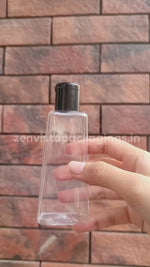 Load and play video in Gallery viewer, Pyramid Shape Clear Transparent Pet Bottle With Black Fliptop Cap 100ml [ZMT90]
