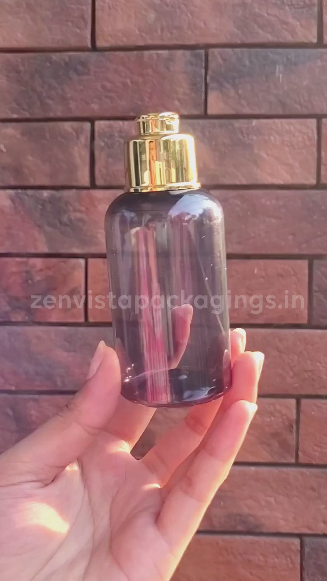 [ZMT104] Transparent Black Color Pet Bottle With Gold Plated Locket Fliptop Cap 100ml