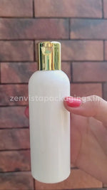 Load and play video in Gallery viewer, |ZMW50| Milky White Bottle With Gold Fliptop Cap  ZMW50 Available Size_100ML
