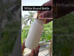 Load and play video in Gallery viewer, [ZMW130] White Round Bottle With Golden Screw Cap - 100ml , 150ml
