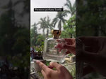 Load and play video in Gallery viewer, [ZMS47] Transparent Perfume Bottle With Gold Cap - 100ml
