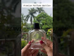 Load and play video in Gallery viewer, [ZMS57] Transparent Perfume Bottle With Black Cap &amp; Gold Streak - 100ml
