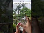 Load and play video in Gallery viewer, [ZMS58] Transparent Perfume Bottle With Black Cap &amp; Gold Streak - 100ml
