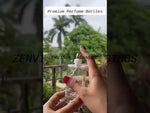 Load and play video in Gallery viewer, [ZMS14] Transparent Round Glass Perfume Bottle With Simple Black Cap - 50ml
