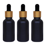 Load image into Gallery viewer, black glass , glass black color bottles , 30ml black droppers , gold plated black droppers , droppers for essential oils , glass droppers , black frosted glass, gold plated black droppers , 30 ml droppers .
